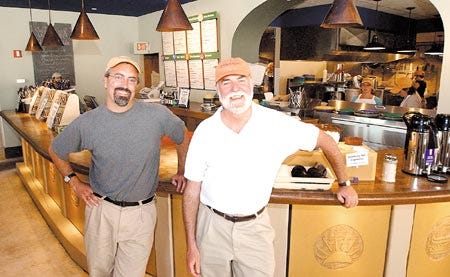 Jay Friedlander, left, and Mac McCabe stand in their new restaurant, O'Naturals, in downtown Portsmouth. The eatery opens today.