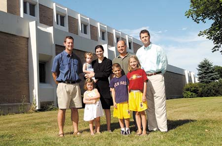A group of people is responsible for the Pease Childcare center at the New Hampshire Community Technical College at the tradeport. From left are Frank Neppo, Stefany Shaheen holding Annah, 1, and Elle Shaheen, 3, John Ricci with Josephy Ricci, 8, and Lexi, 10, and Dan Gray.