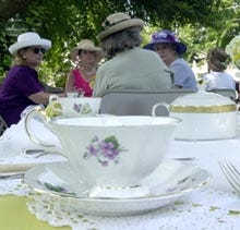 Bone china tea settings await afternoon tea on the front lawn of the Dottridge Homestead, site of the first annual ladies tea, hosted by the Historical Society of Cotuit and Santuit. Gentlemen were welcome, organizers said, but warned they might be in the minority.