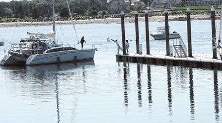 A catamaran pulls up to the Wentworth Marina in New Castle.