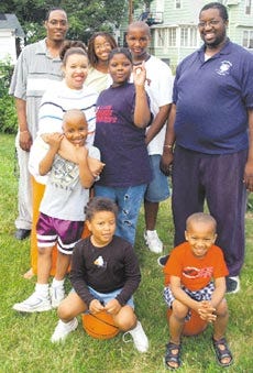 Members of the Burgess/ Del Valle families get together for a group photograph in July 2002 in Hamden, Conn. Associated Press