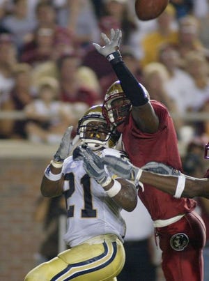 FSU's defense, shown here smothering a Georgia Tech receiver is allowing opponents just 7.7 points a game.