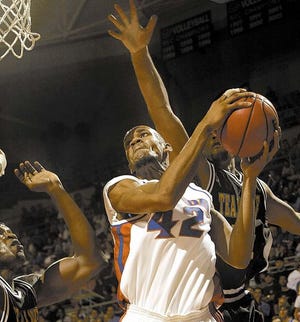 Florida center Bonell Colas gets pressure from the Team Nike defense as he goes up for a second-half shot during Tuesday's 107-73 exhibition win at the O'Connell Center.