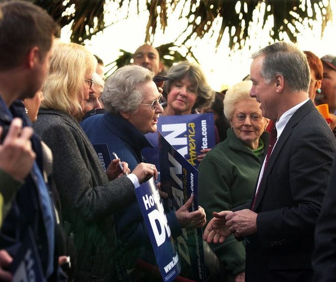 Howard Dean greets people who came to hear him speak in Georgetown Tuesday.