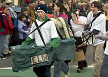 Tyler Sill, 13, of Elmhurst, Ill., dressed as the ship Eldia, jogs down Main Street in Chatham at the start of yesterday's Carnival Caper Road Race.