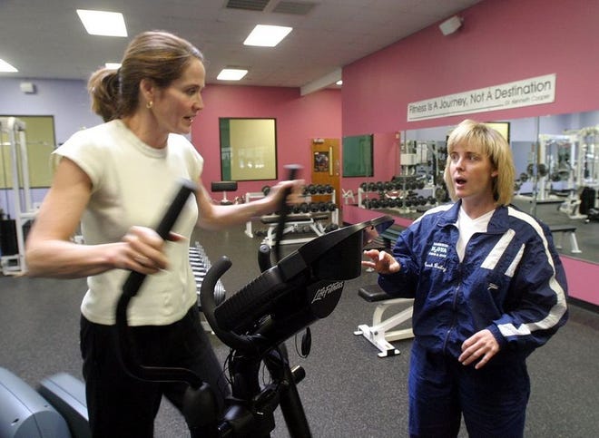 Amy Baily, right, chats with Karen White at The Westside Club. Baily, assistant manager of the club and director of the fitness, aerobic and aquatic programs, says even with all the expanding, there's still room for more.