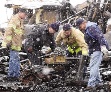Fire investigators sort through the rubble at the Hampton Marina looking for the cause of the blaze.
Jay Reiter/jreiter@seacoast-online.com