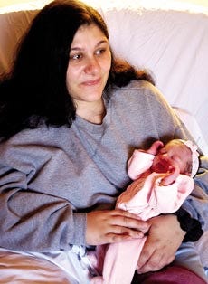 Crystal Goddard of Exeter holds her newborn daughter, Piper Mackenzie, at Exeter Hospital on Thursday. Piper was born at 2:45 a.m., the second baby in the state born in the new year.
Carrie Niland/cniland@seacoastonline.com