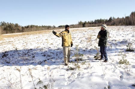 Brian Hart, left, and Peter Dow, of the Rockingham Land Trust, stand in the middle of an open field that is part of a 603-acre contiguous tract of land that has been recently conserved in Exeter and Newfields.
Deb Cram/dcram@seacoastonline.com