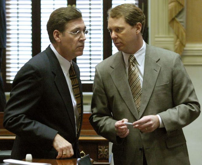 Sen. Jim Ritchie, right, talks with President Pro Tempore Glenn McConnell in the Senate chambers on opening day of the Legislature Tuesday at the Statehouse in Columbia.