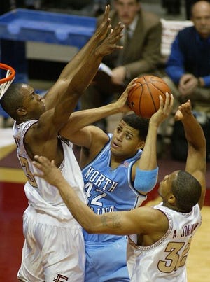 North Carolina's Sean May is stopped by Florida State's Von Wafer on Thursday night.