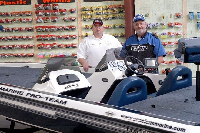 Sessions Marine general manager Dale Rhinehart, left, and owner Bob Sessions opened their business Saturday. They're targeting serious bass fishermen as well as "weekend anglers."