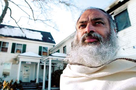 Ramadheen Ramsamooj, pandit of the Saraswati Mandiram Hinu Temple in Epping stands in front ot the temple that was recently damaged by fire.