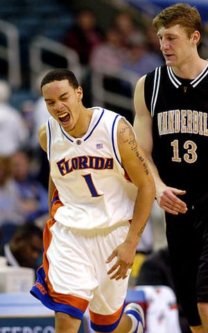 Anthony Roberson reacts after sinking a 3-pointer as the Gators soundly defeated Vanderbilt 91-69. Florida will now face Kentucky in the SEC championship game Sunday.