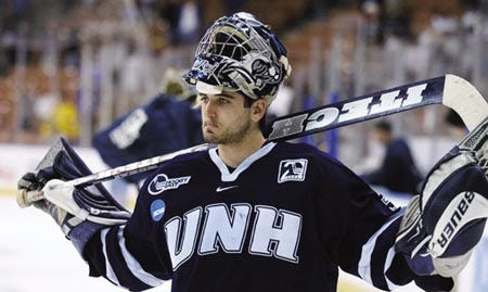 University of New Hampshire senior goaltender, Mike Ayers reacts with dissapointment following the Wildcats' 4-1 loss to Michigan in Saturday's NCAA regional semifinal at Manchester's Verizon Wireless Arena. Ayers helped UNH reach the Frozen Four in 2002 and 2003.
