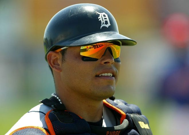 Detroit Tigers' Ivan Rodriguez surveys the field before the start of the first inning against the Montreal Expos on Sunday, March 28, 2004, in Viera, Fla.