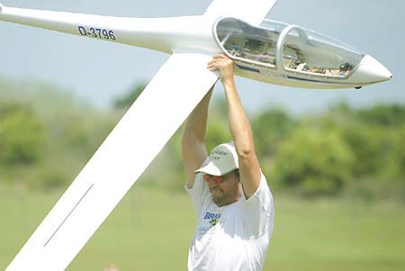Model airplane enthusiast Thomas Landgraf prepares his DG 505M Elan glider for flight Sunday at Vance Way Airfield in Winter Haven. Members of the Lucerne Park Flyers Club meet weekly to fly their model planes.