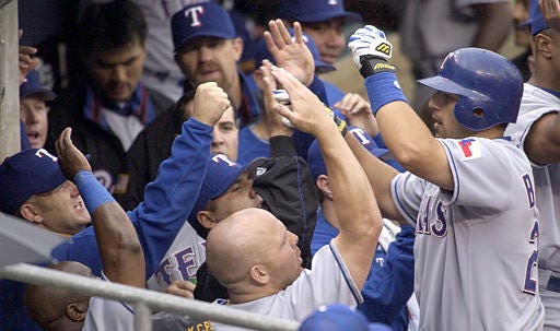 Texas catcher Rod Barajas, right, is greeted after hitting a home run against Kansas City last week.