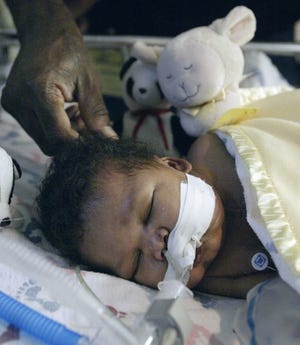 Kerrick Walker, sleeping in this May 11 photo, underwent a heart transplant in St. Petersburg on Thursday.