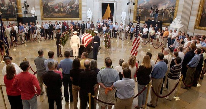 Mourners file past the casket of former President Reagan in the Capitol Rotunda on Thursday in Washington. Still thousands more are expected to pay their final respects before today's funeral service at the National Cathedral.