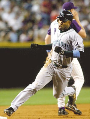 The Tampa Bay Devil Rays' Carl Crawford rounds third on a triple by Robert Fick in the third inning against the Arizona Diamondbacks on Sunday.