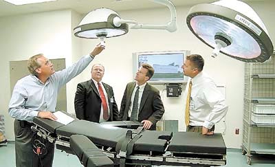 From left, Jack Barnhart with United Way of Central Florida, Rodney Kennedy, project coordinator HMA; along with Neal Boothe and Chris Socha with GRG Consulting Engineers, Inc. look at the surgical lights in a cardiac operating room at Heart of Florida Regional Medical Center's Center for Day Surgery and Cardiac Intensive Care Unit Wednesday.