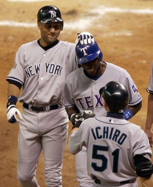 New York Yankees' Derek Jeter, left, congratulates Texas Rangers' Alfonso Soriano, center, after Soriano's three-run homer in the first inning against Houston Astros pitcher Roger Clemens during the All-Star game, Tuesday, July 13, 2004, in Houston. In foreground is Seattle Mariners' Ichiro Suzuki, of Japan. Soriano was the MVP of the 2004 All-Star game.