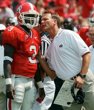 Georgia head coach Mark Richt speaks to quarterback D.J. Shockley at Sanford Stadium in Athens, Ga., in 2003.