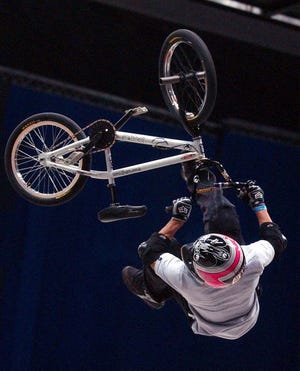 Team USA member Dave Mirra competes in the Bike Stunt Park event during the X Games Global Championship at the Alamodome in San Antonio, in this May 17, 2003 file photo. Some of the games most recognizable athletes are now well outside the youth culture that still defines action sports. The yearly ESPN-sponsored competition begins Thursday.