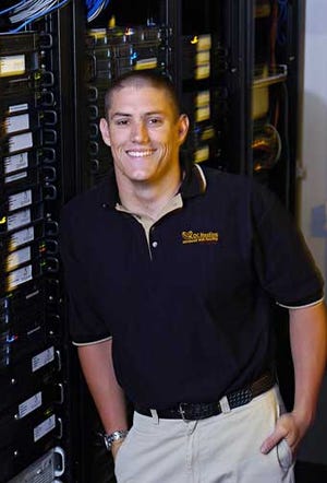 Lance Larson, CEO of OC Hosting, stands by his Web servers at company headquarters in San Clemente, Calif., on July 19.
