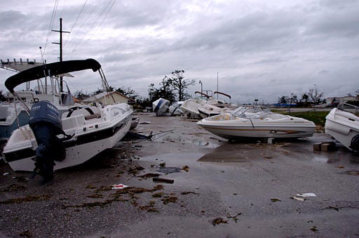 Boats are strewn about at a marina near Punta Gorda, Fla., after Hurricane Charley moved through the area.