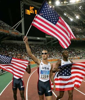 Gold medalist Jeremy Wariner, center, celebrates with silver medalist Otis Harris, right, and bronze medalist, Derrick Brew.