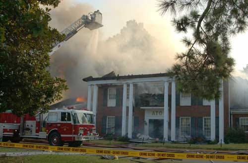 Oxford, Miss., firefighters battle a fire at the Alpha Tau Omega Fraternity House at the University of Mississippi on Friday. Three students died in the late-night blaze.
