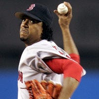 Pedro Martinez threw 113 pitches over six innings of Game 2 of the ALC series yesterday in New York, giving up three runs, including a two-run homer by John Olerud. For the second night in a row, the Red Sox came up short, losing 3-1 to the Yankees.