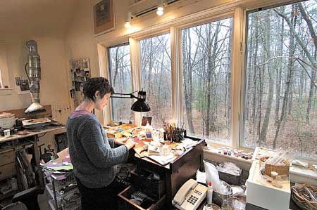 Lauren Pollaro assembles her one-of-a-kind collage pieces in her studio before a big weekend arts festival.