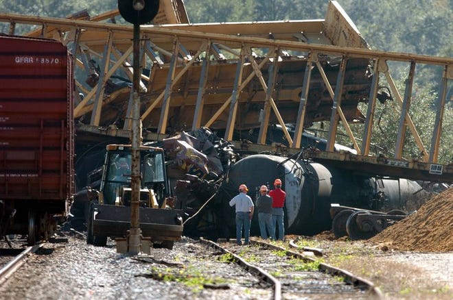Wreckage from two trains that collided Monday, Nov. 29, 2004, lies strewn around the tracks near Dade City, Fla. The two CSX cargo trains collided head-on early Monday morning, killing one crew member and injuring three others, authorities said.