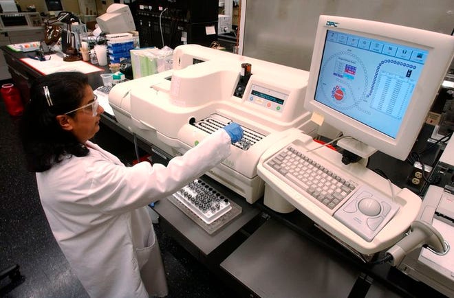 Divya Desai, a research scientist at Becton Dickinson, a medical technology company in Franklin Lakes, N.J., runs immunoassays at one of the company's research labs recently. BD is developing a vaccine delivery system that might one day help stretch flu shots and other vaccinations further.