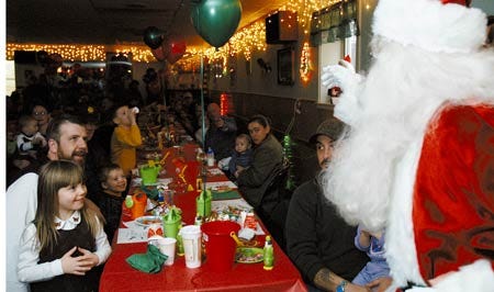Santa Claus draws attention from the crowd upon arriving at York's American Legion Hall's Christmas Party Saturday aftenroon. Children of all ages attended and gifts were given to all.