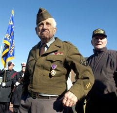Alphege "Frenchy" Nault, 86, of Centerville, an Army veteran of World War II's decisive Battle of the Bulge, listens as other veterans share their experiences during a ceremony yesterday honoring the 60th anniversary of the battle. Nault, who fought with the 3rd Armored Division, said he arrived in the second wave storming Normandy and stayed in Europe until the end of the war.