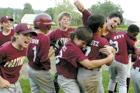 Members of the Portsmouth Little League 11- and 12-year-old All-Star team celebrate after winning the District II championship against Dover on July 21. Portsmouth advanced to the New England Regional in Bristol, Conn., and fell just one win short of a trip to the Little League World Series.