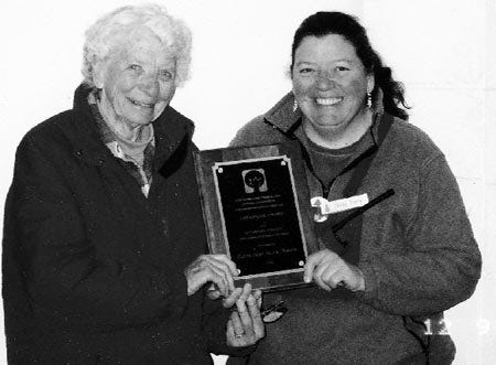 Alice (left) and Abby Tonry hold the John Hoar Award for good stewardship from the Rockingham County Woodland Owners Association.