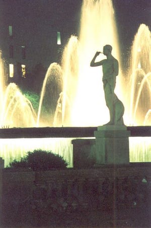 Fountains and classical statues lend nocturnal grace to Pla_a Catalunya, the northern terminus of Las Ramblas, in Barcelona