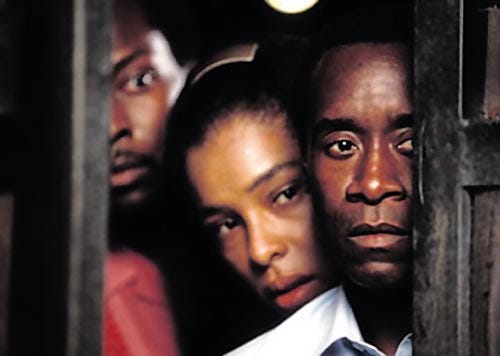 From left, Antonio Lyons, Sophie Okonedo and Don Cheadle star in "Hotel Rwanda," opening Friday.