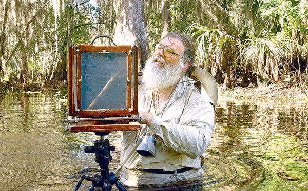 Clyde Butcher makes exposure adjustments in his 8-by-10 view camera on the Peace River in Bartow.