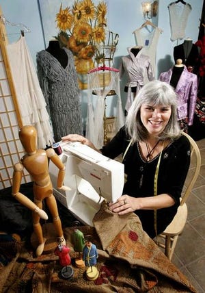 NINA BERGEN:
Gainesville fashion designer Nina Bergen is surrounded by some her creations in her local studio.