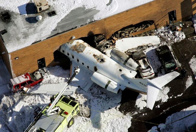 An aerial view of the Canadair Challenger 600 corporate jet that crashed into a building after failing to take off from Teterboro Airport in New Jersey on Wednesday.
