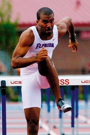 Florida's Josh Walker lands after the final hurdle on the way to winning the 110-meter hurdles at the Southeastern Conference track and field championships in Oxford, Miss., Sunday, May 16, 2004.