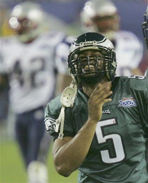 Philadelphia quarterback Donovan McNabb walks off the field near the end of the second quarter Sunday of Super Bowl XXXIX against New Engalnd in Jacksonville.