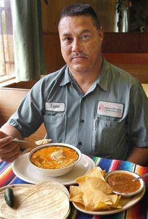 Lupe Rodriguez is ready to start in on a feast of fideo con pollo (vermicelli with chicken), at America's Restaurant, in Harlingen, Texas, Thursday, Jan. 27, 2005. His bowl of fideo, made in a soupy version with plenty of stock, is served with corn tortillas, a jalapeno pepper, and hot salsa with tortilla chips.