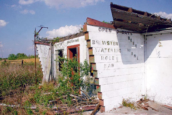 The abandoned shell of the Brewster Watering Hole -- a beer bar -- still stands on State Road 37 south of Mulberry, one of the few surviving remnants of a company-built phosphate mining town.